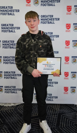 Photo of Alfie with his award